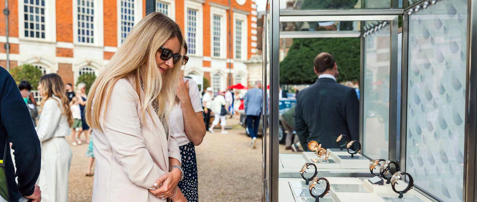 Admiring Watches on Display at Concours of Elegance